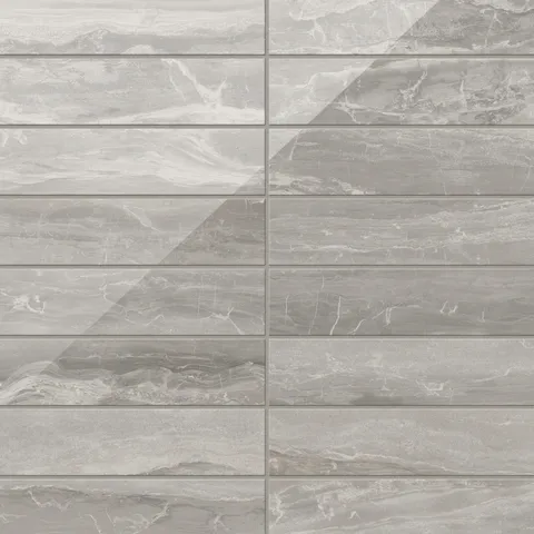 With flowing veining and a polished taupe surface, these 3x12 tiles merge earthy tones with a lustrous sheen, creating a stylish and sophisticated design.