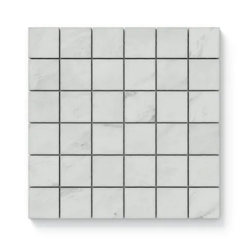 White matte mosaic tiles in a 2x2 grid, featuring soft white and grey marble-inspired veining for a clean and timeless look.