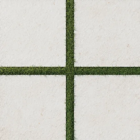 Bowden Canvas 24x24 2CM Grip tile in a light cream tone, paired with vibrant green turf for a modern outdoor aesthetic.