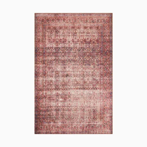 Durable power-loomed polyester rug in scarlet red and navy blue, featuring an intricate transitional medallion pattern for timeless appeal.