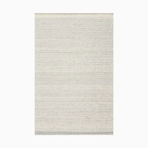 Light gray handwoven rug made of wool, cotton, and polyester, featuring soft horizontal striations and a woven fabric-like texture, creating a subtle and organic aesthetic.