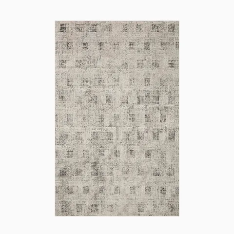 Made from high-quality polyester, this power-loomed transitional rug showcases a soft taupe-gray foundation with stone-washed accents for a timeless look.