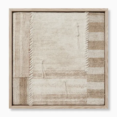 Patchwork textile wall art with intersecting woven panels, fringed edges, and stitched details in warm neutral, earthy hues.