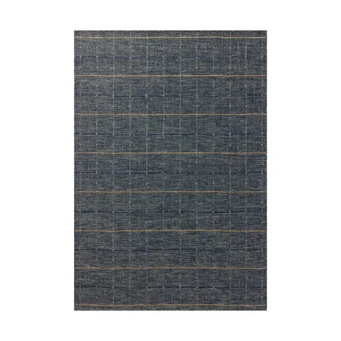 Textured woven rug design with a deep navy blue base, layered with fine beige and bright blue linear strokes that create a hand-drawn, grid-like pattern with subtle movement and visual depth.