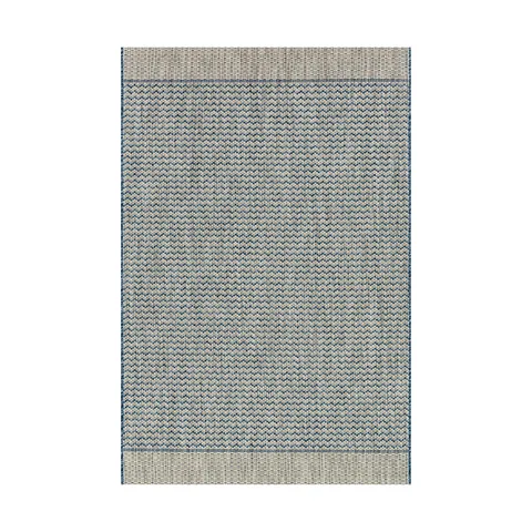 Flatweave indoor/outdoor rug with a blue and light gray zigzag pattern, bordered by wide neutral bands for a crisp, coastal-inspired finish.