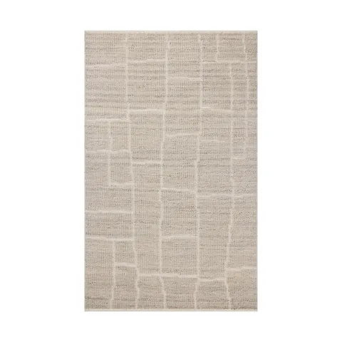 Hand-loomed from a GoodWeave-certified wool-cotton blend, this rug features a grayish beige surface with subtle rectangular lines formed through a flattened weave.