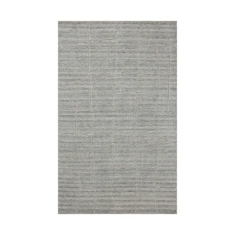This bluish gray rug features abstract rectangular linework created by a tightening, flattened weave, crafted from an eco-friendly wool, cotton, and polyester blend for soft, lasting wear.