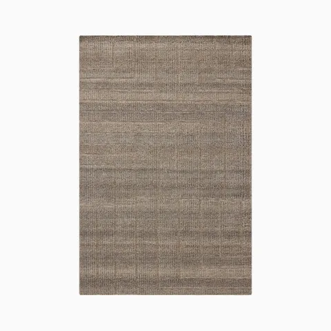 This 2'0" x 3'0" brown rug shows subtle shifts in tone and angular geometric lines, hand-loomed from an eco-friendly blend of wool, cotton, and polyester for a warm, easy feel.