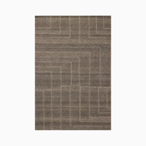 Woven from an eco-friendly blend of wool, cotton, and polyester, this 4'0" x 6'0" rug features a brown surface with soft tonal shifts and angular lines that feel quietly geometric.