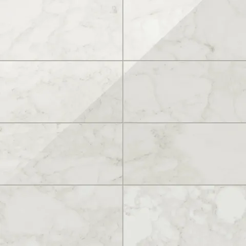 Polished Carrara Bianco porcelain marble looktile in 12x24 format, featuring light grey veining on a bright white base for timeless, versatile elegance.