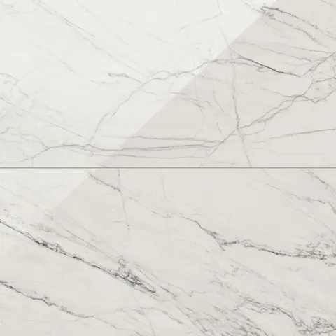 Close-up of Calacatta Quarzite marble look tiles with light grey veining on a soft white base, offering a sleek and polished aesthetic.