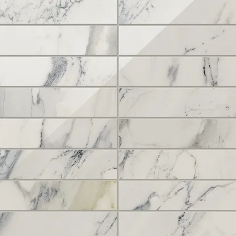 White polished Calacatta Antico marble look tiles in 3x12 dimensions, featuring luxurious light grey veining and subtle golden accents.