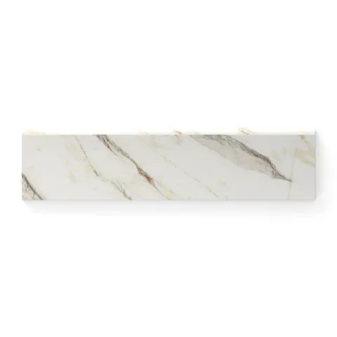 Calacatta Viola 3x12 bullnose marble look tile in a matte finish, featuring beige and gold veining for a luxurious edge detail.