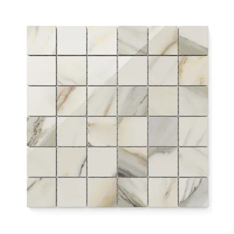 Polished Calacatta Cremo 2x2 mosaic marble look tiles with warm beige and taupe veining, adding a touch of elegance and warmth to any design.