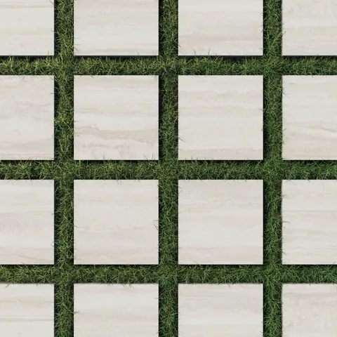 Modern 12x12 beige-toned porcelain pavers with a 2cm outdoor grip matte finish, arranged over vibrant green grass for a clean and natural look.