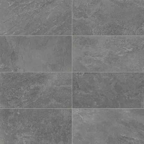 Porcelain tiles in a 12x24 format featuring a matte charcoal finish, showcasing natural stone-inspired textures for contemporary indoor or outdoor designs.
