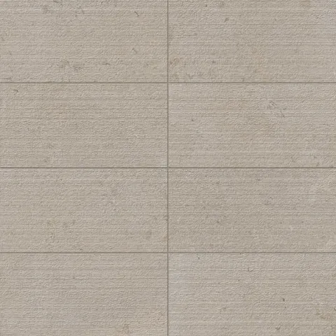 A 12x24 dune beige porcelain tile featuring a chiseled texture, ideal for adding a rustic yet refined look to floors or walls in any space.