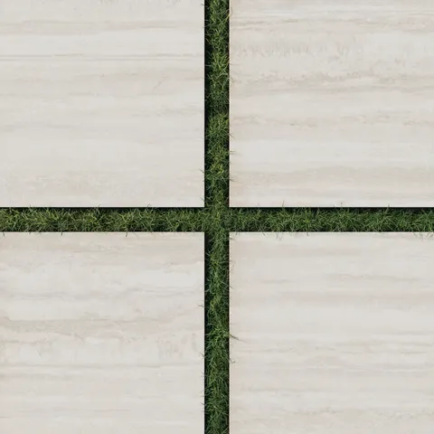Large Wren 24x24 oat-toned porcelain pavers with a 2cm outdoor grip matte finish, perfectly spaced over lush green grass for a seamless natural design.