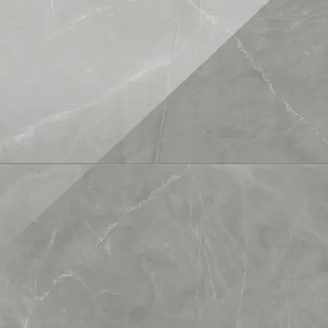 Leona 24x48 polished porcelain tile in Amani Grey, featuring smooth gray tones with elegant marble-inspired veining.