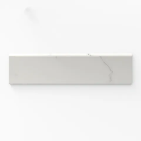 Matte Leona Calacatta 3x12 bullnose tile with soft gray veining, offering a refined and contemporary finish.