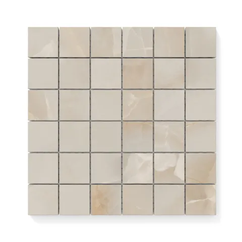 Astrid 2x2 matte porcelain mosaic tile in Sand, showcasing warm beige tones and a subtle marble-inspired veining in a mosaic design.
