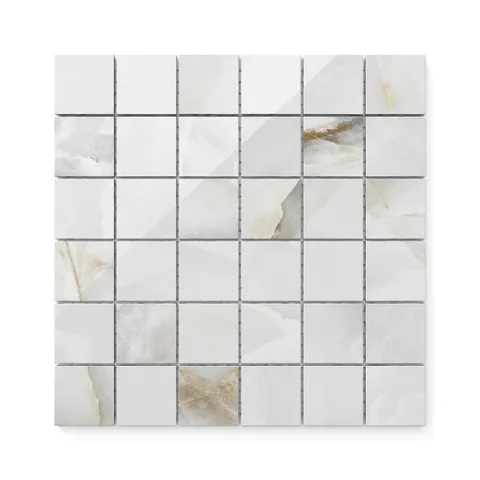 Astrid 2x2 polished porcelain mosaic tile in Pearl, featuring a glossy finish with delicate veining and a creamy white palette.