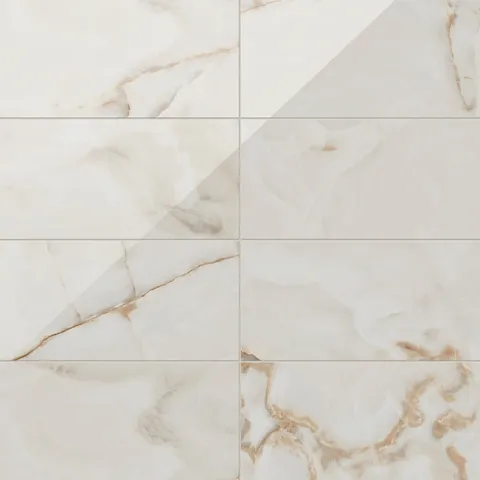 Astrid 12x24 polished porcelain tile in Alabaster, featuring a glossy finish with soft beige and golden veining for a luxurious design.