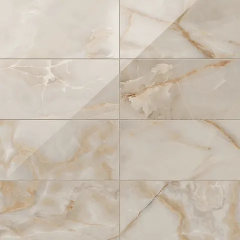 Astrid 12x24 polished porcelain tile in Sand, showcasing a glossy finish with rich golden and beige veining for an elegant design.