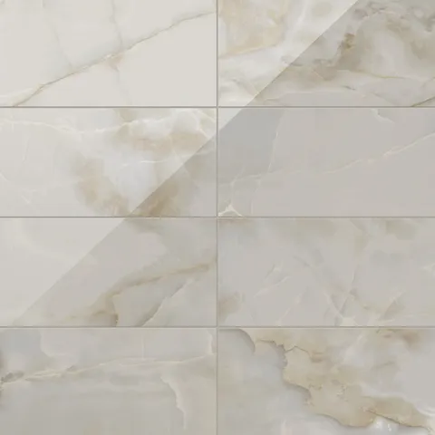 Astrid 12x24 polished porcelain tile in Oyster, featuring a glossy surface with subtle beige and cream veining for a refined look.