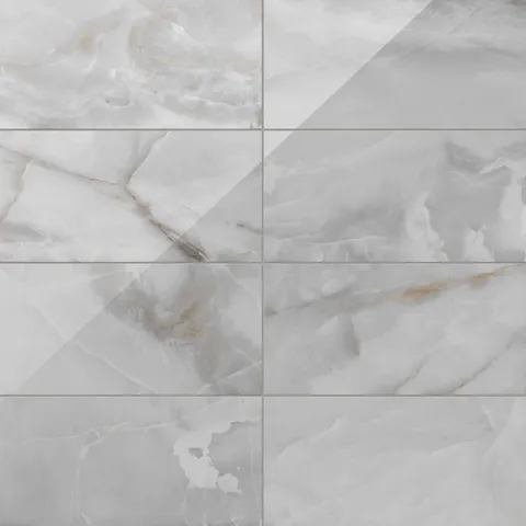 Astrid 12x24 polished porcelain tile in Slate, showcasing a sleek marble-like pattern with shades of gray and subtle veining.