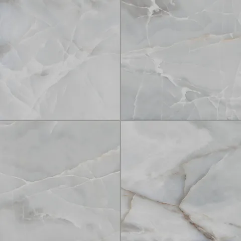 Astrid 24x24 matte porcelain tile in Slate, featuring a natural stone-like appearance with cool gray tones and subtle veining.