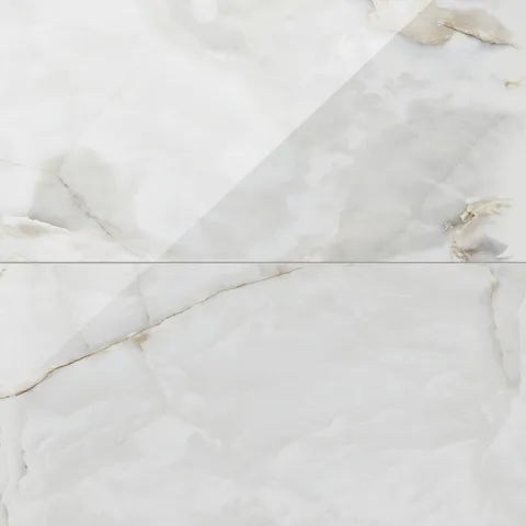 Astrid 24x48 polished porcelain tile in Pearl, featuring a luxurious glossy surface with soft veining and creamy white tones.