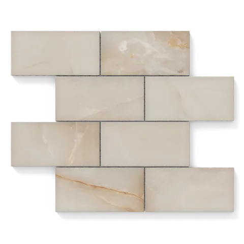 Astrid 3x6 Matte Porcelain Mosaic Tile in Sand, showcasing warm beige tones with subtle veining for elegant interiors.