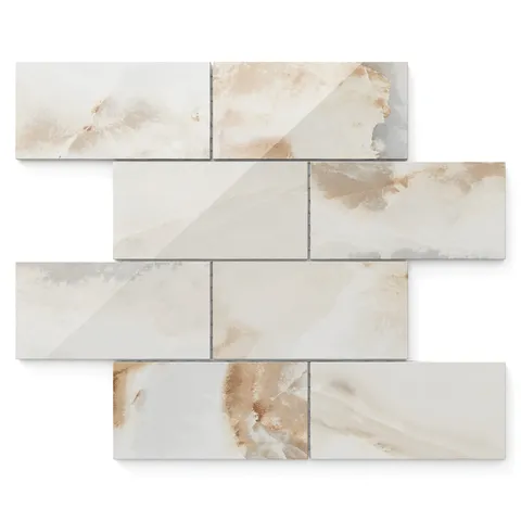 Astrid 3x6 polished porcelain mosaic tile in alabaster, featuring warm beige tones with a glossy, reflective finish.
