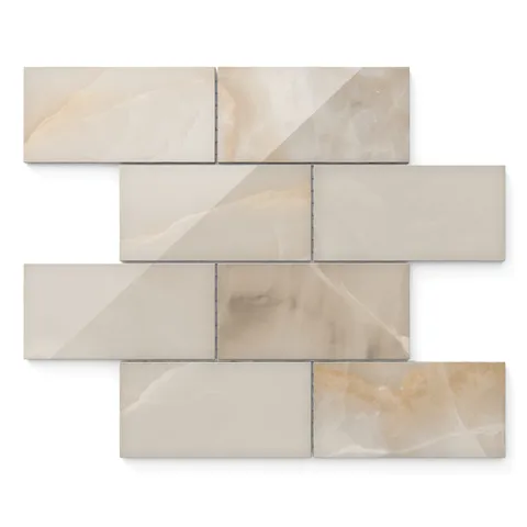 Astrid 3x6 polished porcelain mosaic tile in sand featuring soft beige tones and subtle veining for elegant wall applications.