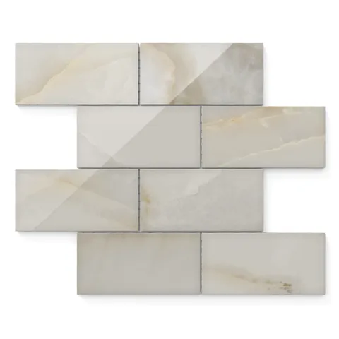 Astrid 3x6 polished porcelain mosaic tile in oyster showcasing neutral tones and soft veining for sophisticated wall styling.