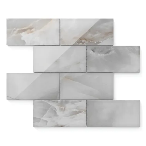 Astrid 3x6 polished porcelain mosaic tile in slate featuring a sleek gray palette with soft veining for modern wall designs.
