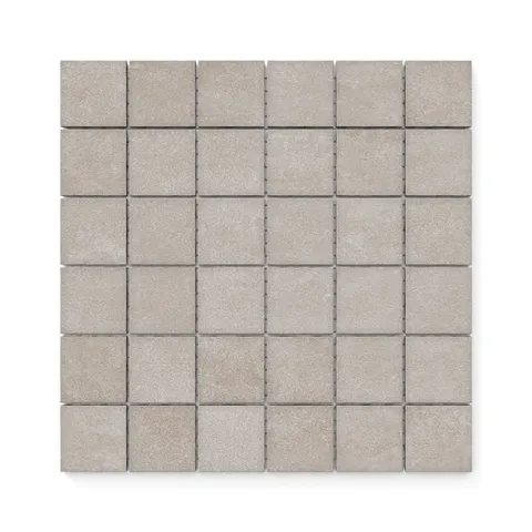 Wyatt Ash 2x2 matte mosaic tiles, featuring a neutral stone finish perfect for creating textured, modern surfaces in any space.