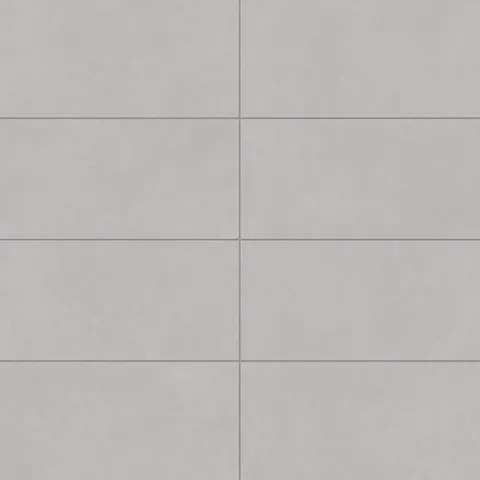 Wyatt Fog 12x24 matte porcelain tiles, featuring a soft gray tone with subtle variation, ideal for creating sleek and timeless interiors.