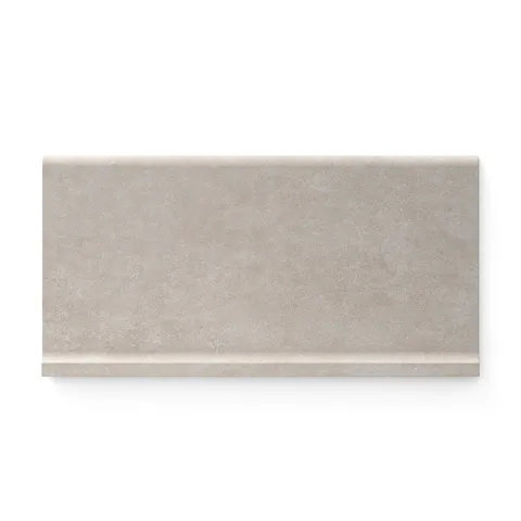 Soft ash-toned Wyatt 6x12 matte porcelain cove base tiles, designed to deliver a smooth and refined transition for modern interior spaces.