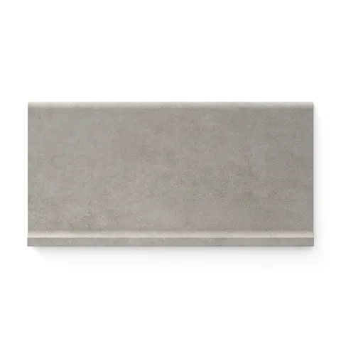Subtle stone-toned Wyatt 6x12 matte porcelain cove base tiles, offering a natural, textured finish for seamless and modern interior designs.