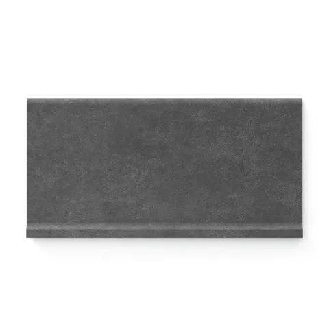 Bold iron-toned Wyatt 6x12 matte porcelain cove base tiles, delivering a dramatic, textured finish for striking and modern interiors.