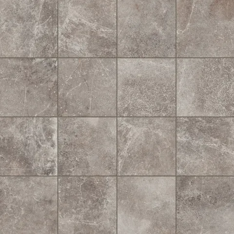 Porcelain tile in a 12x12 format with a matte finish, featuring a taupe stone-like texture enhanced by intricate veining for timeless elegance.
