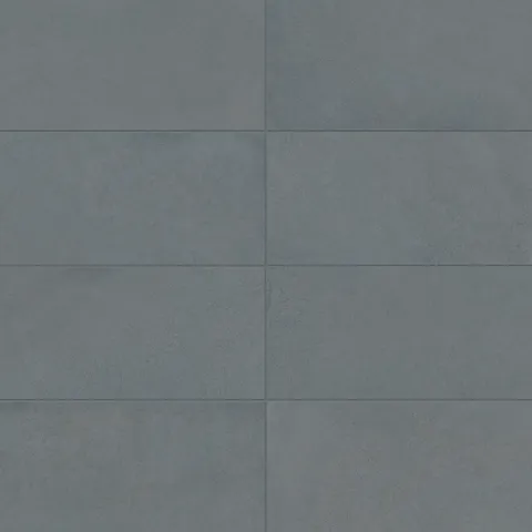 Palmer 12x24 matte porcelain tile in ocean blue showcasing a smooth finish and deep blue-gray tones.