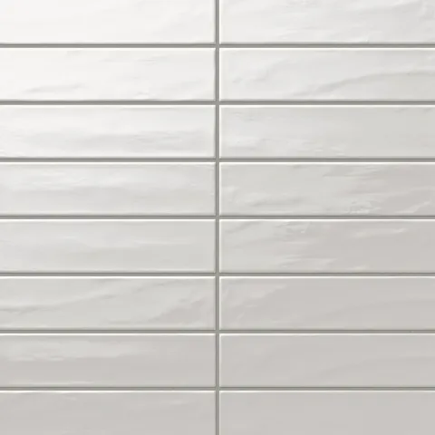 Palmer 3x12 glossy porcelain tile in Bianco featuring a sleek, reflective surface perfect for walls or backsplashes.