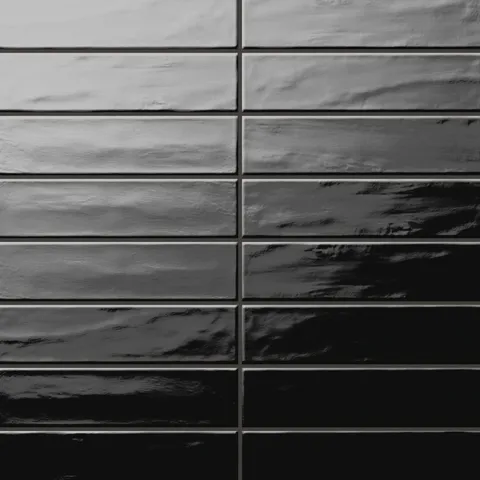 Palmer 3x12 glossy porcelain tile in nero, featuring a deep black finish with a sleek, wavy texture.