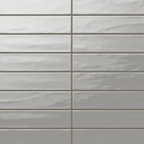 Palmer 3x12 glossy porcelain tile in smoke, offering a refined gray tone with a glossy sheen for sleek interior designs.