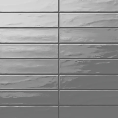 Palmer 3x12 glossy porcelain tile in storm, showcasing a sleek gray shade with a reflective finish for contemporary spaces.