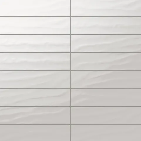 Palmer 6x24 Glossy Porcelain Tile in Bianco showcasing its wavy texture and modern glossy finish, ideal for elegant interiors.