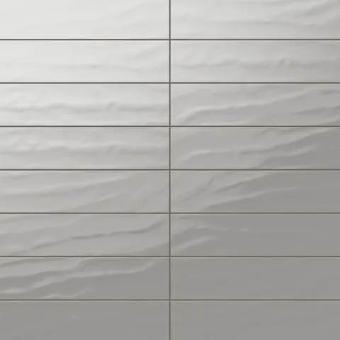 Palmer 6x24 glossy porcelain tile in smoke, featuring a sleek grey finish for a refined, contemporary appeal.